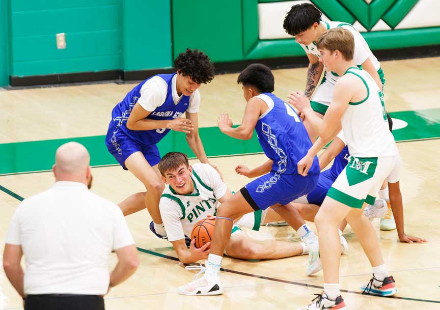 Moriarty's Sam Pearce looks for an open player for a pass.